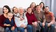 © JackF - Adults with children are posing for Christmas photos.