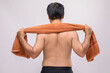 Close up man holding towel to rub the body dry after shower. To used wet towel can be the dermatitis on the body concept