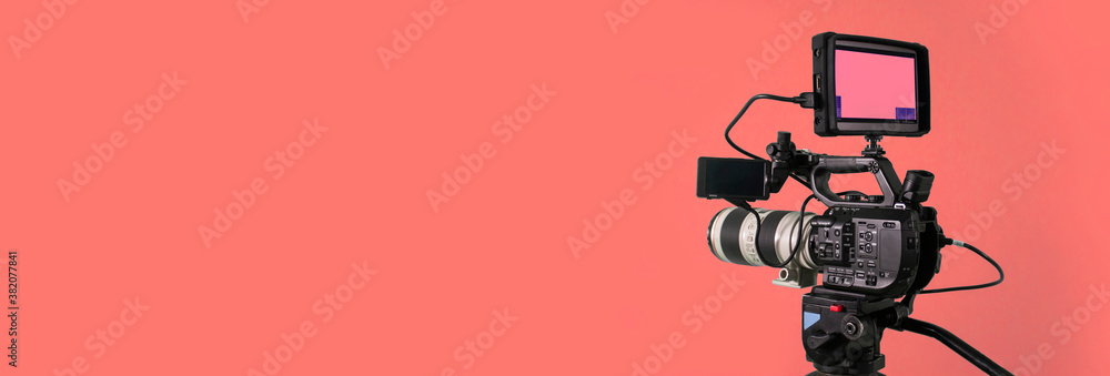digital video camera on soft red background Stock Photo | Adobe Stock