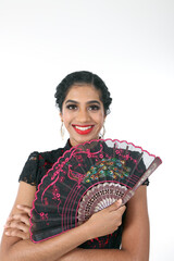 Wall Mural - South east Asian Indian race ethnic origin woman wearing Chinese dress costume Cheongsam holding hand fan multiracial community on white background