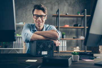 Portrait of his he nice attractive cheerful cheery confident geek guy top tech manager remote part-time building process teamwork at modern concrete wall interior style work place station indoors