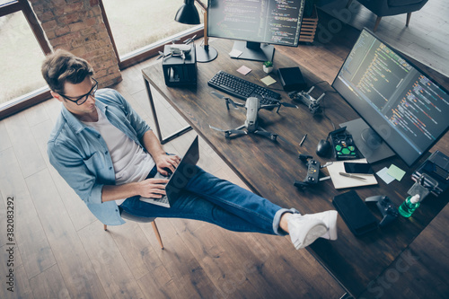 Obraz na PCV Top above high angle view of his he nice attractive focused skilled guy geek typing coding web development remote support security safety at modern loft industrial home office work place station