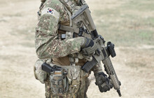 Soldier With Assault Rifle And Flag Of South Korea On Military Uniform. Collage.