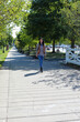 © Debbi Truax - Woman enjoying a morning walk at Ontario Beach Park in Rochester, New York