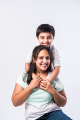 Indian pretty young mother and little boy or son embracing on white background