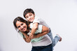 © StockImageFactory - Indian pretty young mother and little boy or son embracing on white background