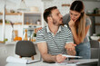 © JustLife - Husband and wife preparing bills to pay. Young couple having financial problems.