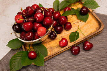 Wall Mural - Fresh cherries in bowl on table.