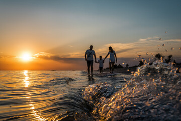 Wall Mural - family on sunset at the beach