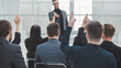 © yurolaitsalbert - employees ask questions to the speaker during the business seminar.