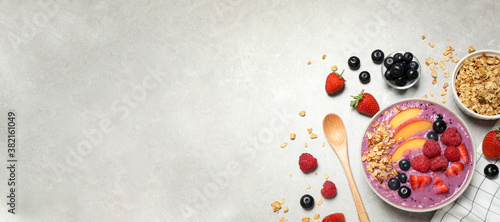 Fotografía Delicious acai smoothie in bowl and ingredients on light grey table, flat lay