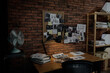 © New Africa - Detective workplace near brick wall in office