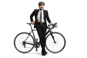 Canvas Print - Businessman with a helmet leaning on a bicycle