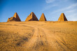 Road leading to pyramids in Sudan at daylight.