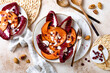Roasted pumpkin salad with radicchio leaves, feta cheese, nuts and cranberries. Thanksgiving side dish dinner recipe. Healthy seasonal fall or autumn food