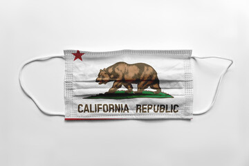 Wall Mural - Face mask with California flag printed, on white background, isolated