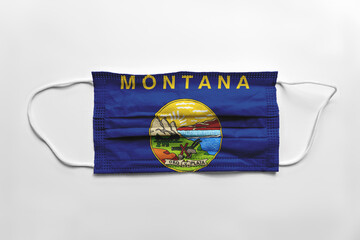 Canvas Print - Face mask with Montana flag printed, on white background, isolated