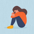Sad depressed woman sitting hugging her knees. Vector illustration in flat style