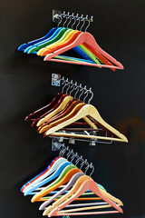 Wall Mural - Colorful coat hangers on clothes rail in store