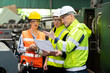 © godji10 - Selective Focus. Supervisor, Technician worker working in heavy Industry manufacturing factory on business day. Industrial engineers have to consult with colleagues. Workplace gender equality concept