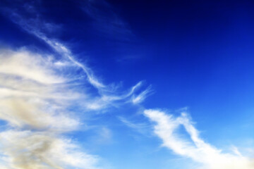 light clouds in the deep sky