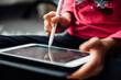 © MaaHoo Studio/Stocksy - Cute girl studying with tablet for education and touch pen