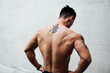 © MaaHoo Studio/Stocksy - Portrait bare chested man with tattoos