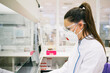 © Inuk Studio/Stocksy - Young woman wearing safety mask and goggles while working in innovative laboratory.