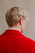 Blond Male Model In Trendy Bright Red Suit