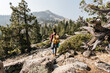 © Kristen Curette Photography LLC/Stocksy - Tourist with backpack hiking in mountains at Lake Tahoe in California, USA