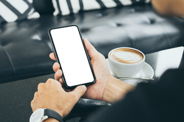 cell phone mockup blank white screen.man hand holding texting using mobile on desk at coffee shop.background empty space for advertise.work people contact marketing business,technology