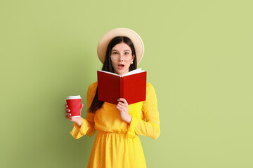 Poster - Surprised young woman with book and coffee on color background