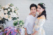 © 9Thaweekiat - Asian man and woman couples Smiling and happy hugging.