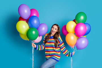 Poster - Photo of candid satisfied cute girl hold many balloons enjoy holiday party celebration wear good look mood clothes isolated over blue color background