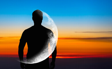 silhouette of man with transparent crescent or moon on body in front blue sky during sunset, concept