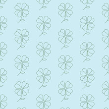 The Seamless Pattern With The Green Clover On The Blue Background.