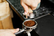 © fotofabrika - Woman coffee shop worker preparing coffee on professional coffee machine