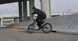 © Kaponia Aliaksei - Extreme bmx cyclist doing bike tricks