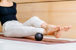 © Iryna - Woman holding massage percussion device ideal for muscle soreness after fitness exercise, muscle strain after high-intensity workouts, and physical and mental exertion after sitting in the office.