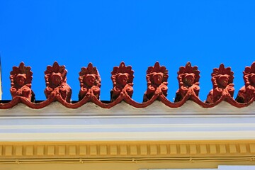 Wall Mural - Decorative elements on the rooftop of a neoclassical house, in the traditional neighborhood of Plaka in Athens, Greece.