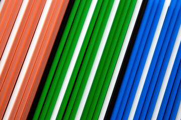 Wall Mural - top view of multi coloured  plastic  drinking straws in a row