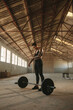 © Jacob Lund - Fitness woman exercise with barbell in old warehouse