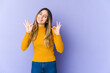 © Asier - Young caucasian woman isolated on purple background cheerful and confident showing ok gesture.