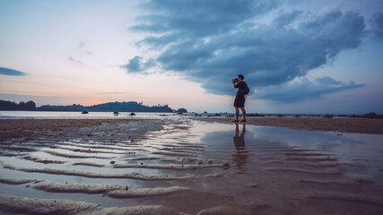 Wall Mural - Nature Photographer Setting Digital Camera