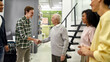 © Svitlana - Young team greeting new worker in the modern office, Aged man, senior intern shaking hands with his colleagues