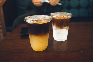 Wall Mural - Iced coffee put a glass on the table in a coffee shop.