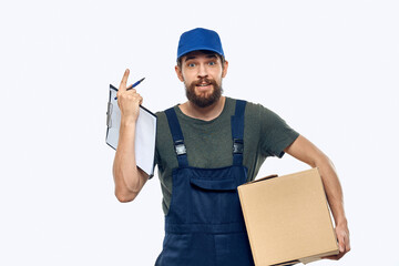 Man in working uniform box delivery loader courier light background