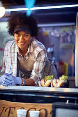 Wall Mural - Food truck employee taking orders from customers