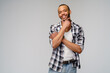 © Anatoly Repin - african-american young man wearing casual shirt over light grey background