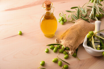 Wall Mural - Olive oil and sack with raw olives elevated view